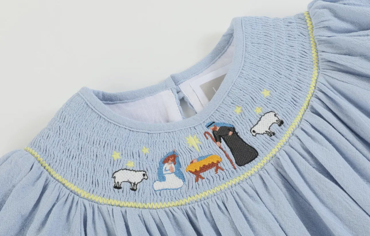 Light Blue Nativity Smocked Bishop
Sleeve Dress